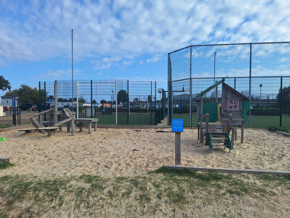 A playground with a sandbox and play equipment at Haven Seashore, Ellerton Willerby Xtra Great Yarmouth