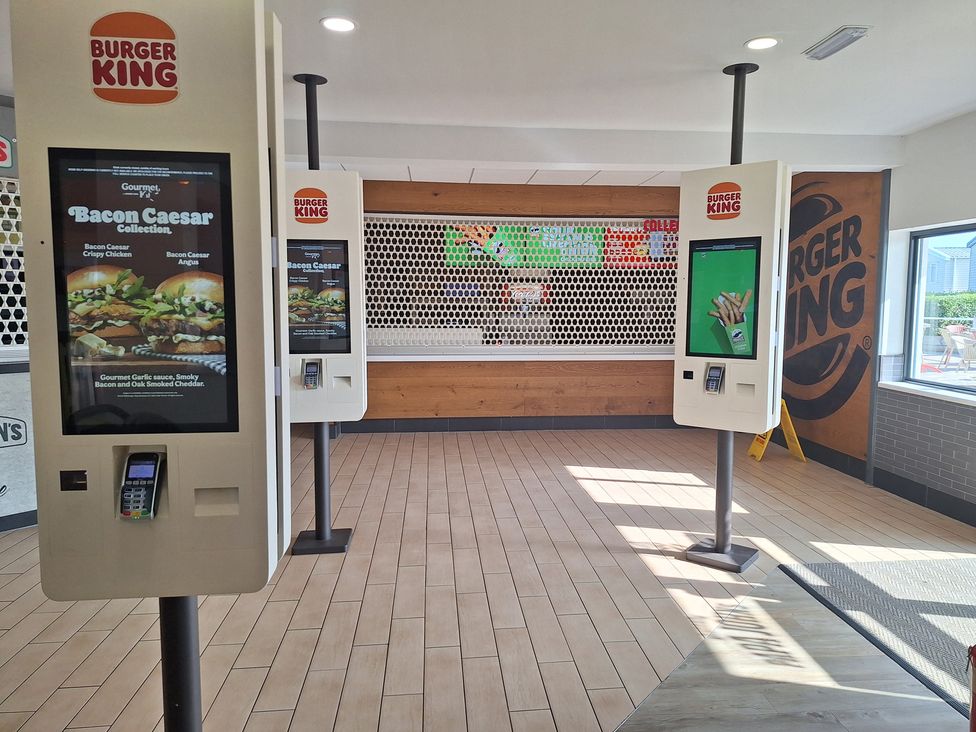 An interior of a fast food restaurant with ordering kiosks at Haven Seashore, Ellerton Willerby Xtra, Great Yarmouth