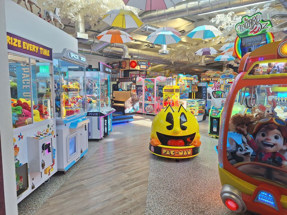 A game area with arcade games and claw machines at Haven Seashore, Ellerton Willerby Xtra, Great Yarmouth