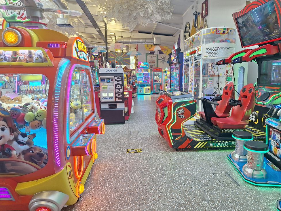 An arcade filled with various gaming machines at Haven Seashore, Ellerton Willerby Xtra, Great Yarmouth