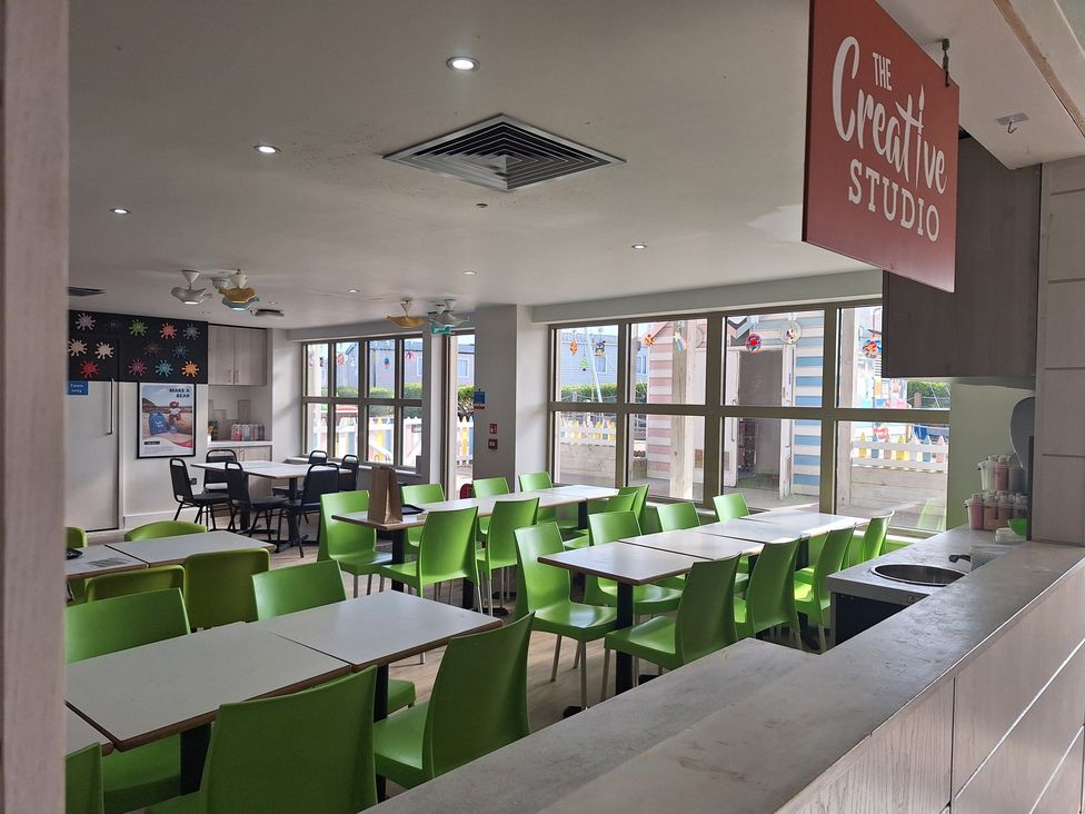 A dining room with tables and chairs at The Creative Studio in Great Yarmouth