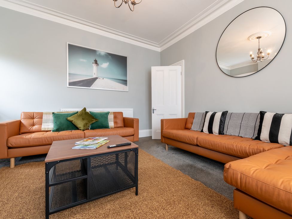 A living room with two sofas and a coffee table at 59 Garfield Road in Scarborough