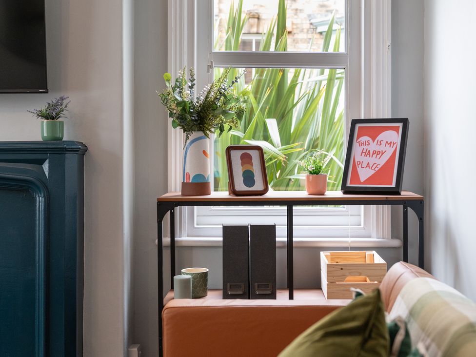 A shelf with plants and decorative items at 59 Garfield Road in Scarborough