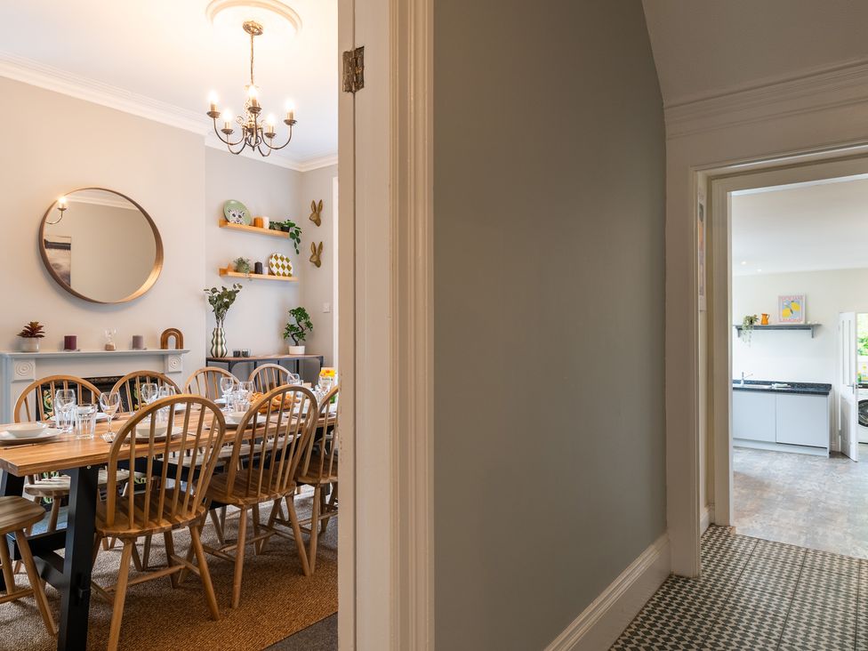 A dining room with a table set for dinner at 59 Garfield Road in Scarborough