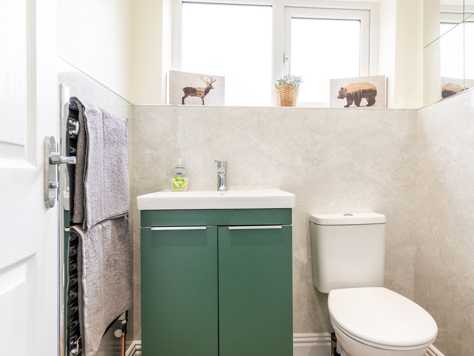 A bathroom with a sink and toilet at 59 Garfield Road in Scarborough