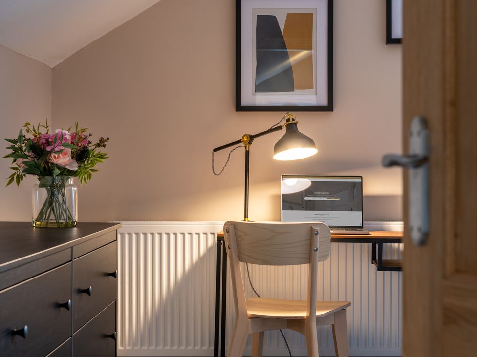 A home office with a desk and computer at 59 Garfield Road, Scarborough
