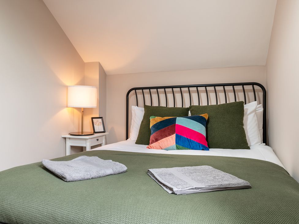 A bedroom with a bed and lamp at 59 Garfield Road Scarborough