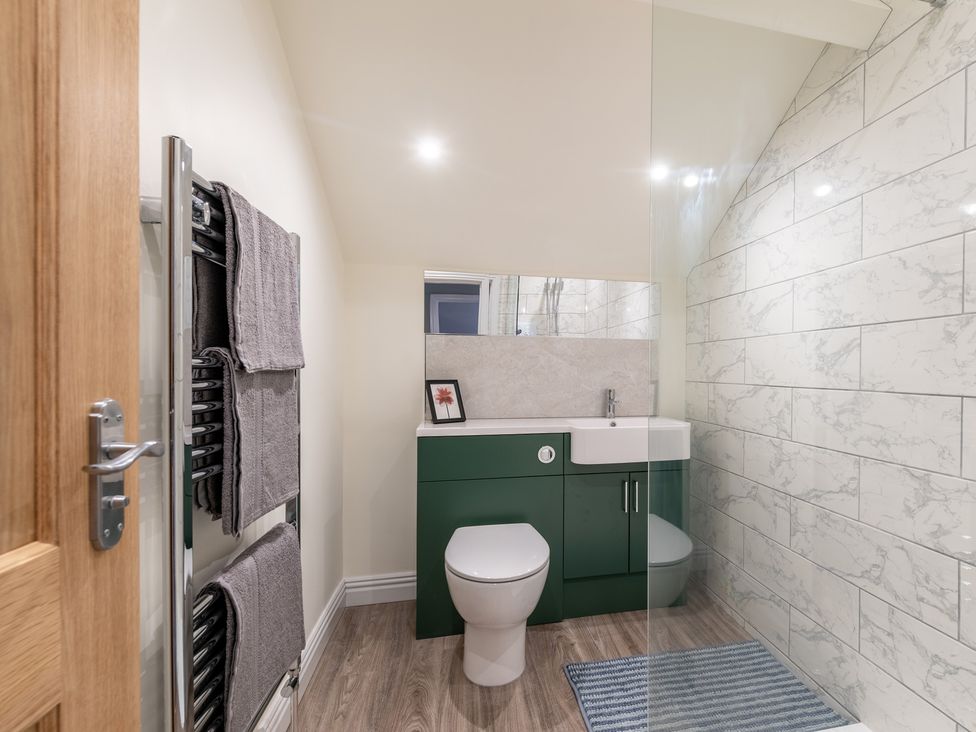 A bathroom with a toilet and sink at 59 Garfield Road Scarborough