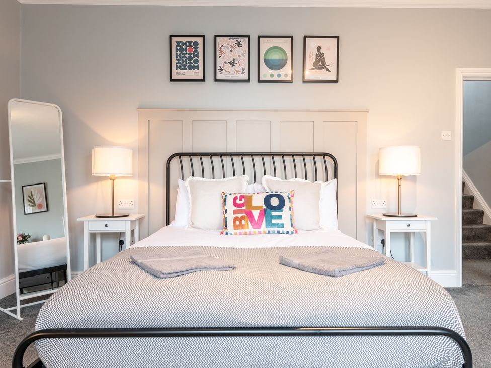 A bedroom with a bed and decorative items at 59 Garfield Road in Scarborough