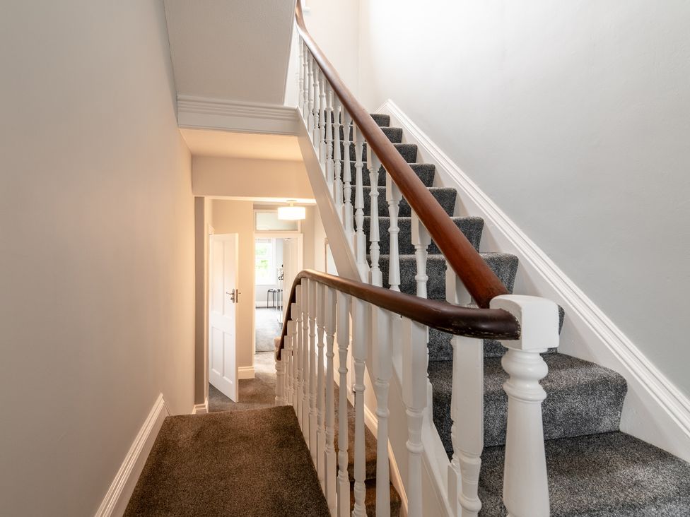 A hallway with stairs and a door at 59 Garfield Road Scarborough
