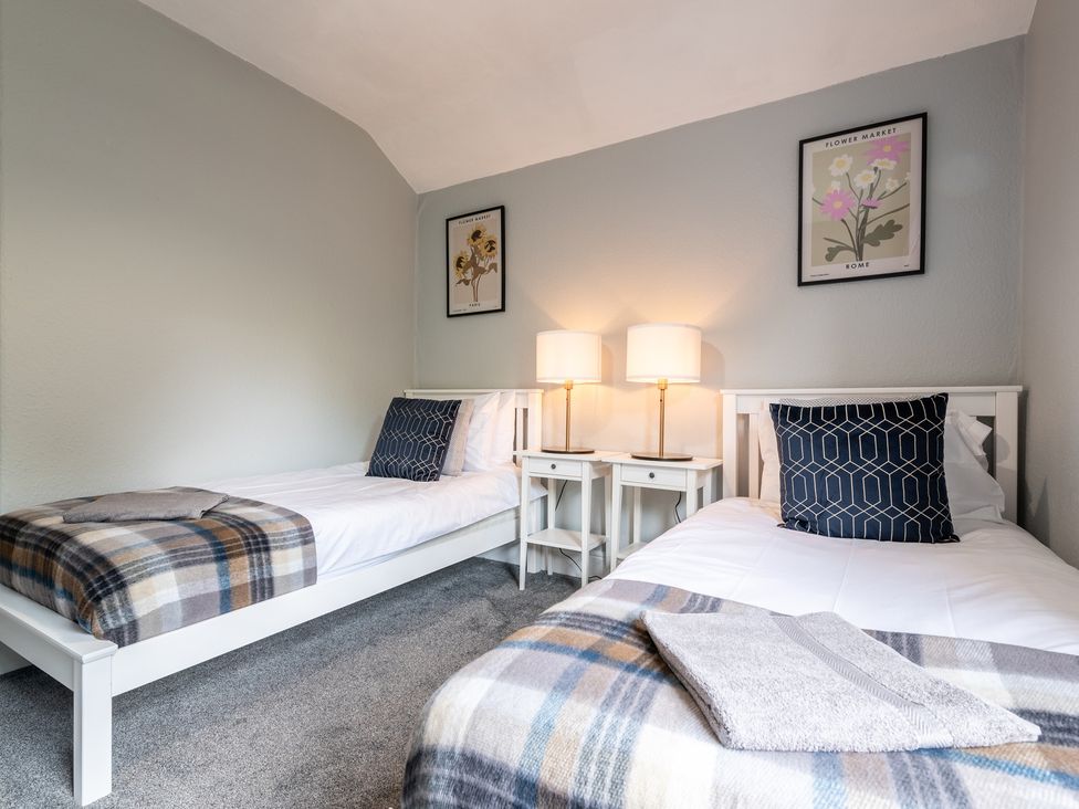 A bedroom with two beds and lamps at 59 Garfield Road, Scarborough