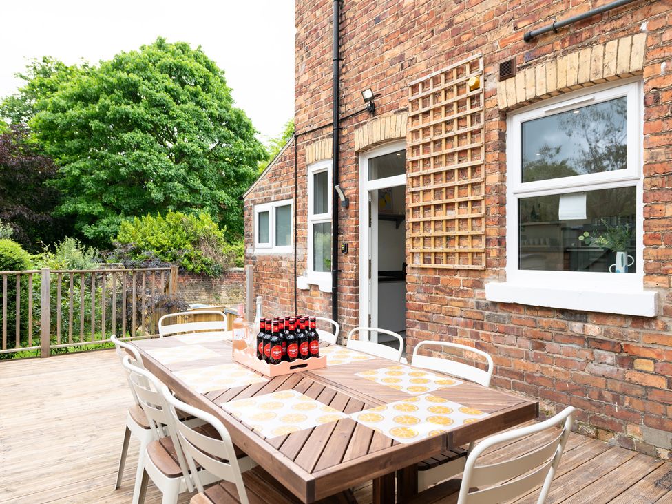 A dining area with a table and chairs at 59 Garfield Road, Scarborough