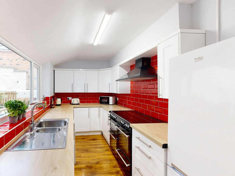A kitchen with cabinets and appliances at 44 Norwood Street Scarborough
