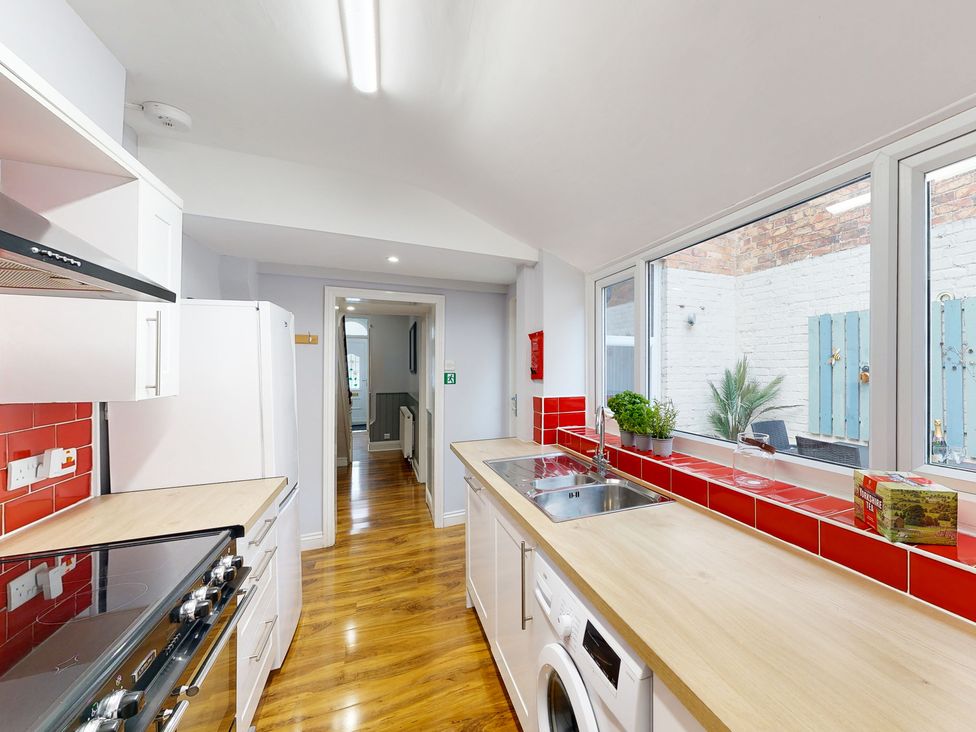 A kitchen with a refrigerator and stove at 44 Norwood Street Scarborough