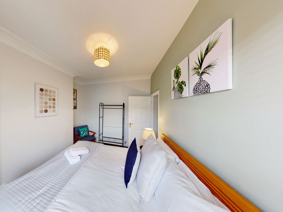 A bedroom with bed and decorative elements at 44 Norwood Street Scarborough