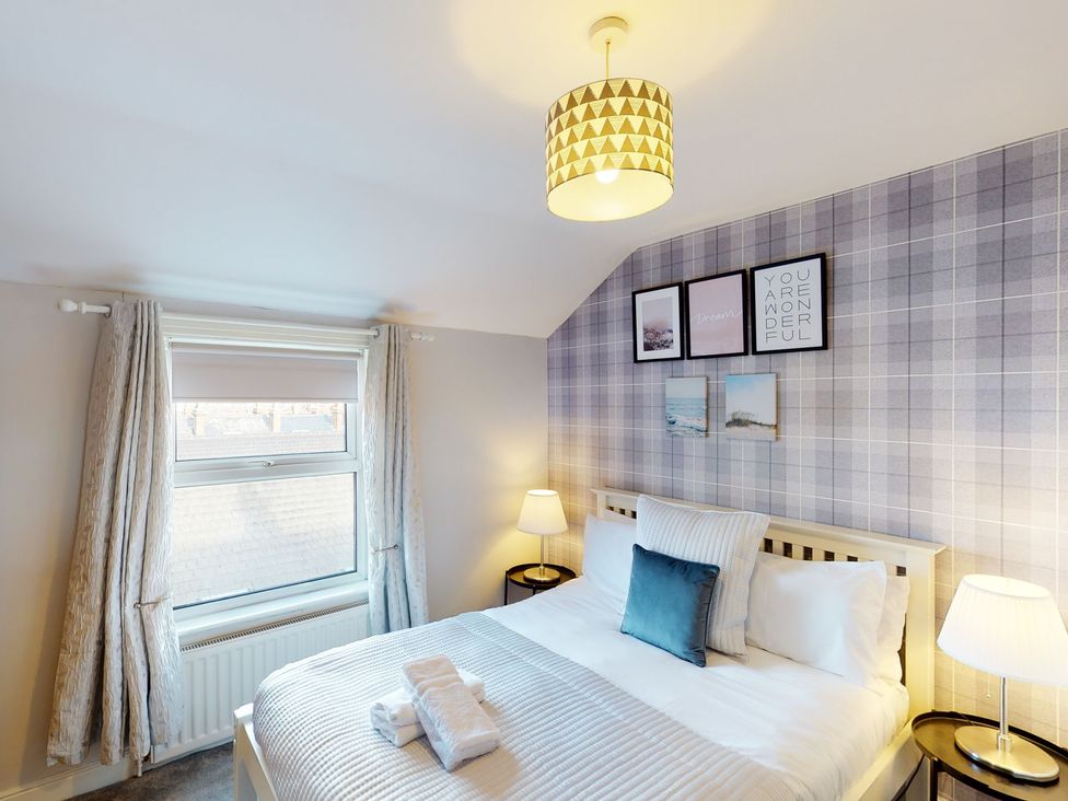 A bedroom with a bed and window at 44 Norwood Street in Scarborough
