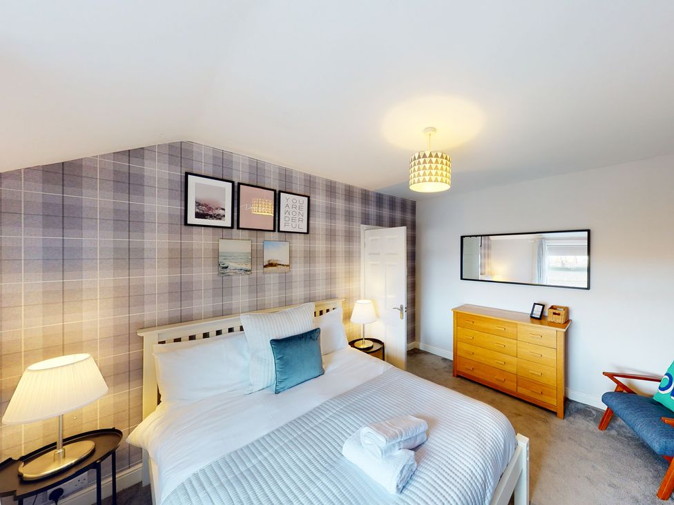 A bedroom with a bed and dresser at 44 Norwood Street Scarborough