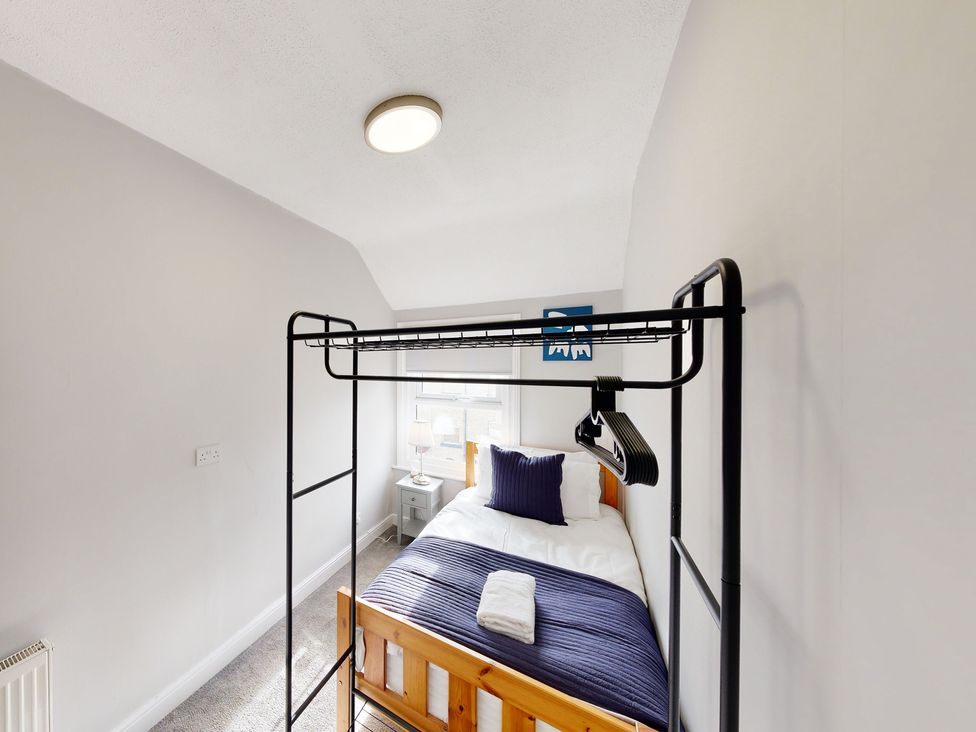 A bedroom with a bed and a bedside table at 44 Norwood Street Scarborough