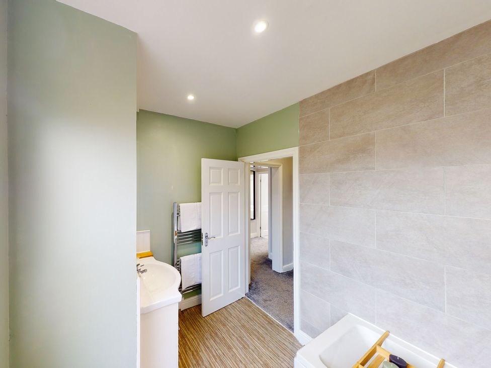 A bathroom with a sink and towel rack at 44 Norwood Street Scarborough