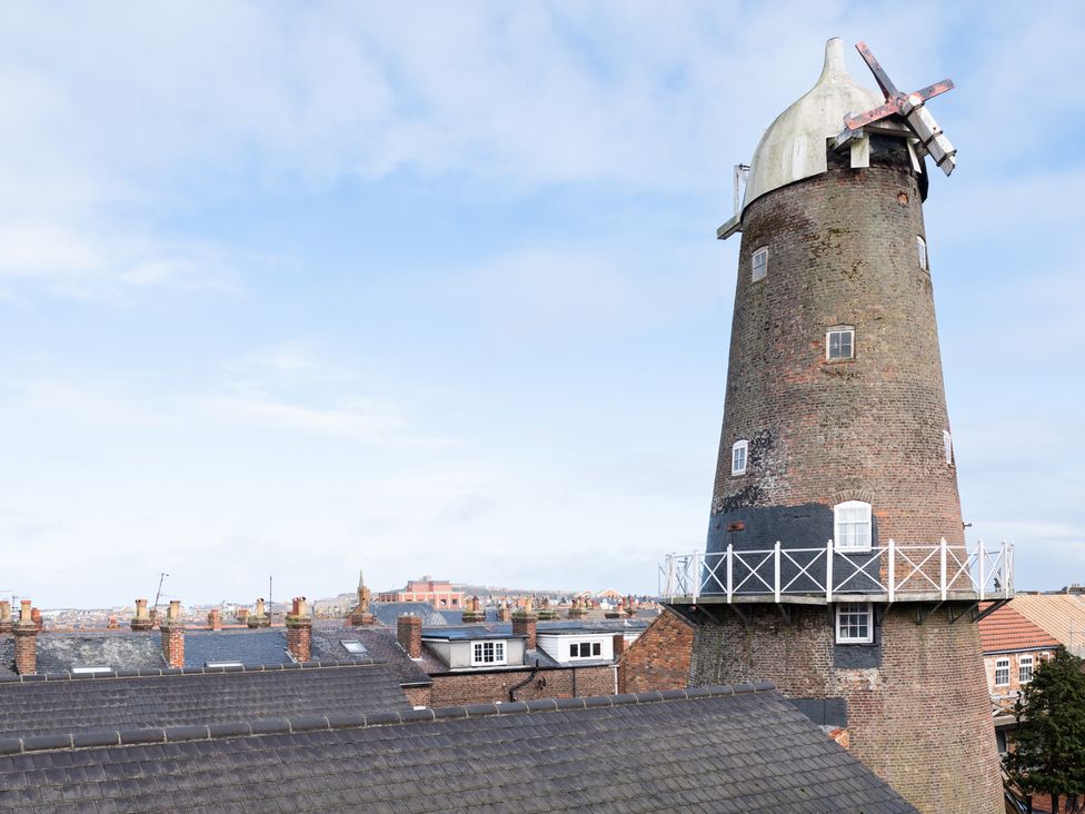 A windmill overlooking roofs in Scarborough