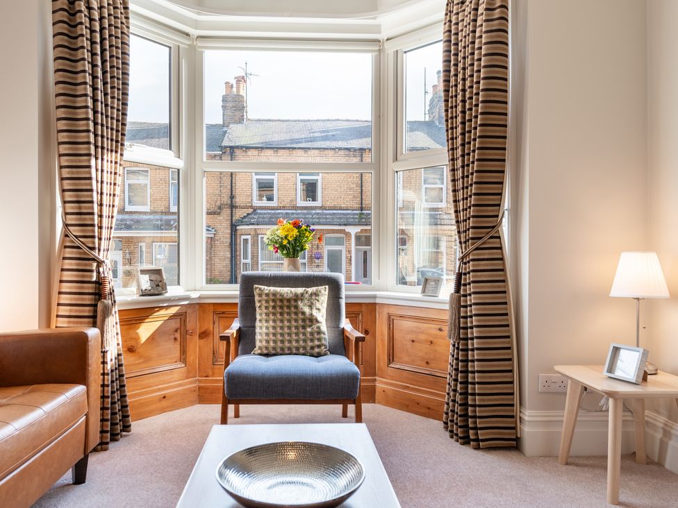 A living room with a window view at 18 Mayville Avenue, Scarborough
