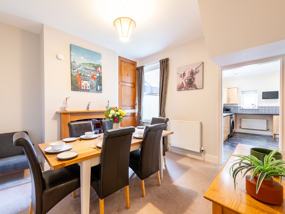 A dining room with a table and chairs at 18 Mayville Avenue Scarborough