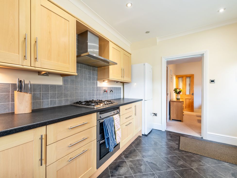 A kitchen with cabinets and appliances at 18 Mayville Avenue Scarborough
