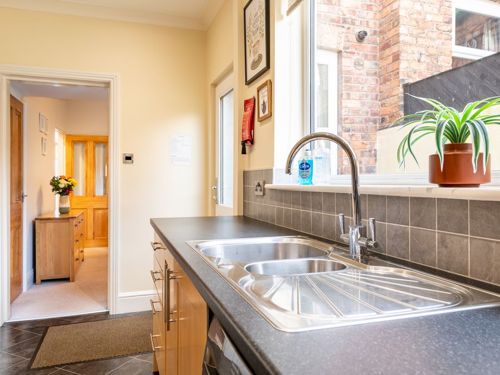A kitchen with a sink and tap near a window at 18 Mayville Avenue Scarborough