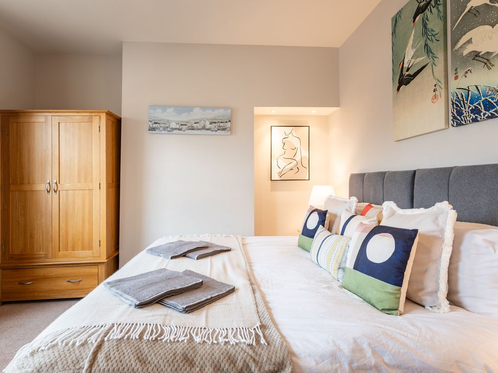 A bedroom with a bed and wardrobe at 18 Mayville Avenue in Scarborough