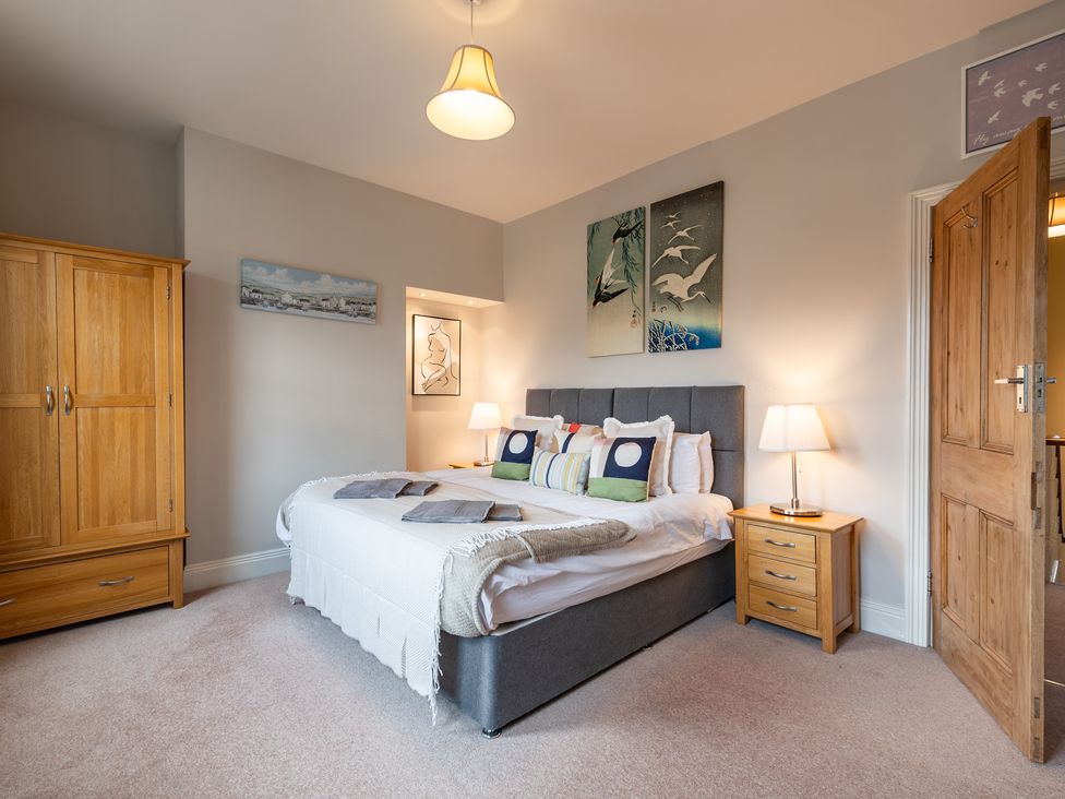A bedroom with a bed and wardrobe at 18 Mayville Avenue Scarborough
