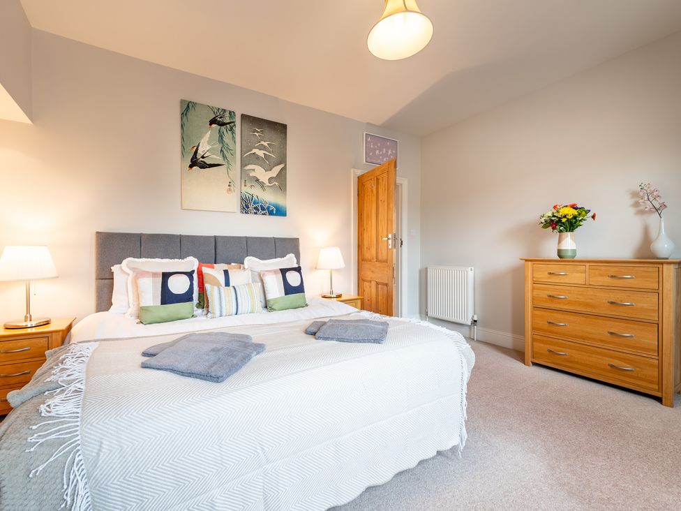 A bedroom with a bed and furniture at 18 Mayville Avenue in Scarborough