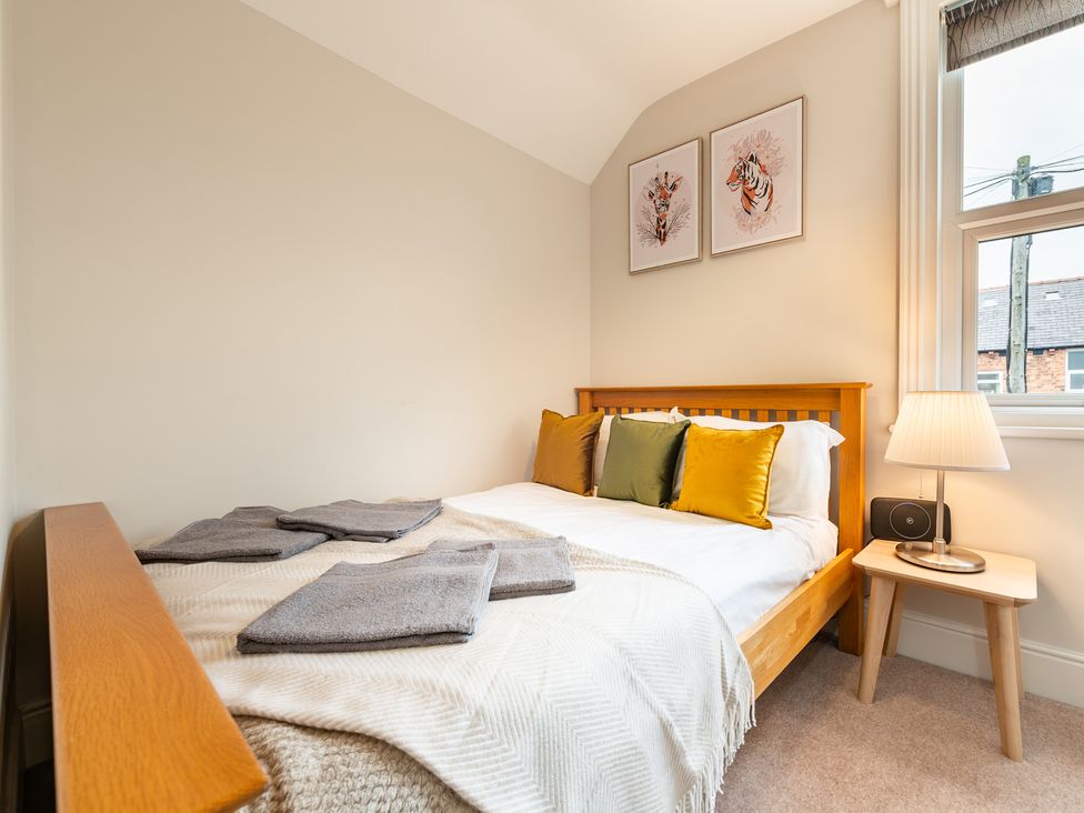 A bedroom with a bed and art on the wall at 18 Mayville Avenue in Scarborough