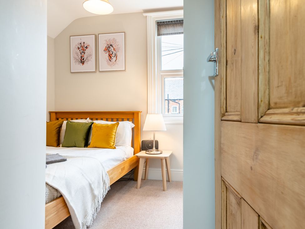A bedroom with a bed and decorative art at 18 Mayville Avenue, Scarborough