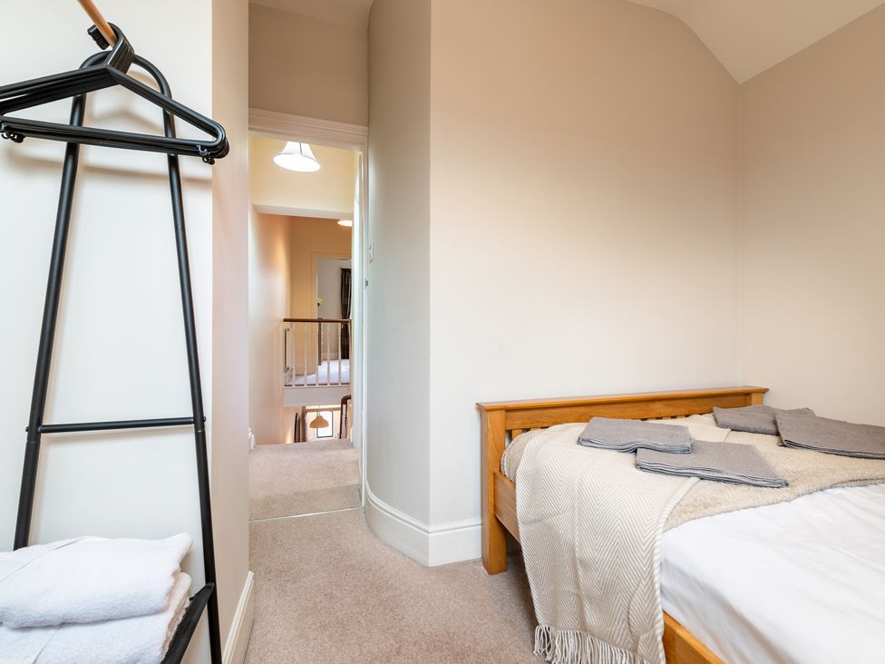 A bedroom with a bed and hanger at 18 Mayville Avenue in Scarborough