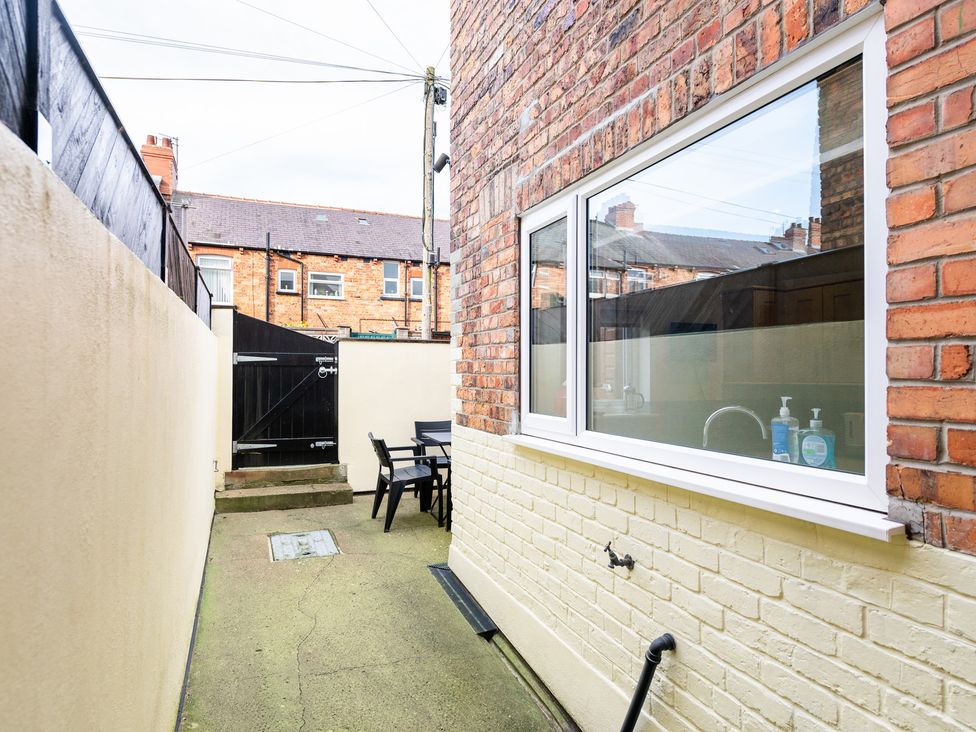 An outdoor area with a table and chairs at 18 Mayville Avenue, Scarborough