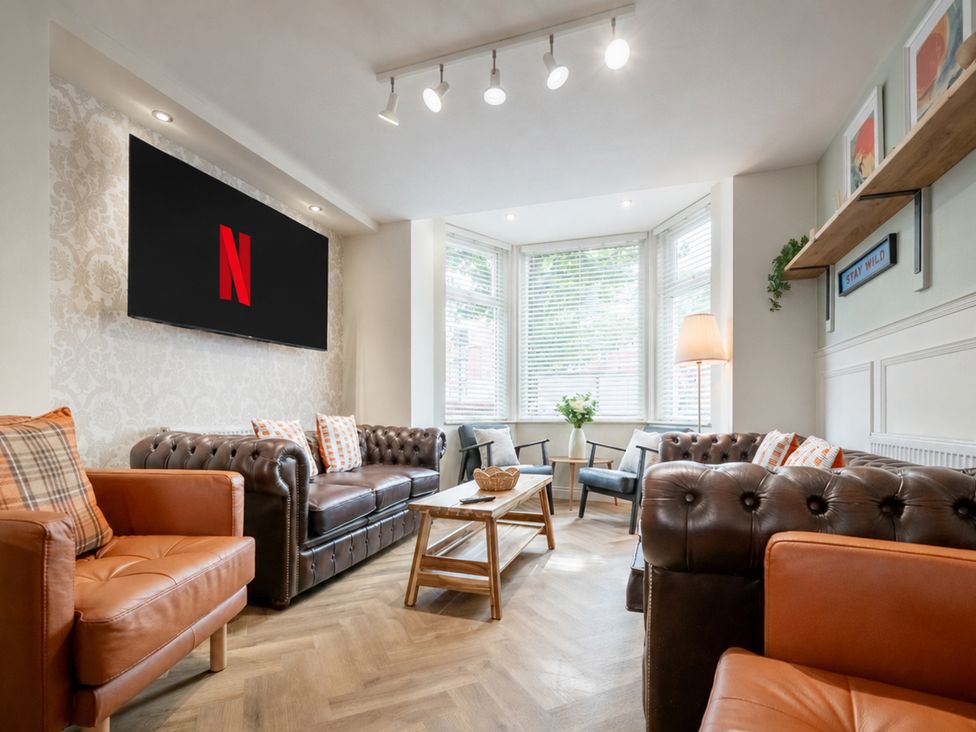 A living room with a tv and seating arrangements at 125 Columbus Ravine in Scarborough