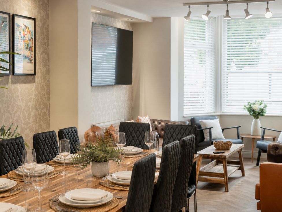 A dining room with a table set for dinner at 125 Columbus Ravine in Scarborough