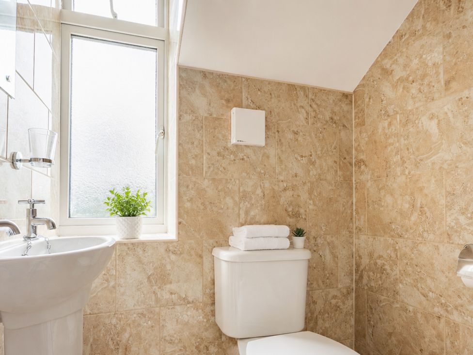 A bathroom with a sink and toilet at 125 Columbus Ravine, Scarborough