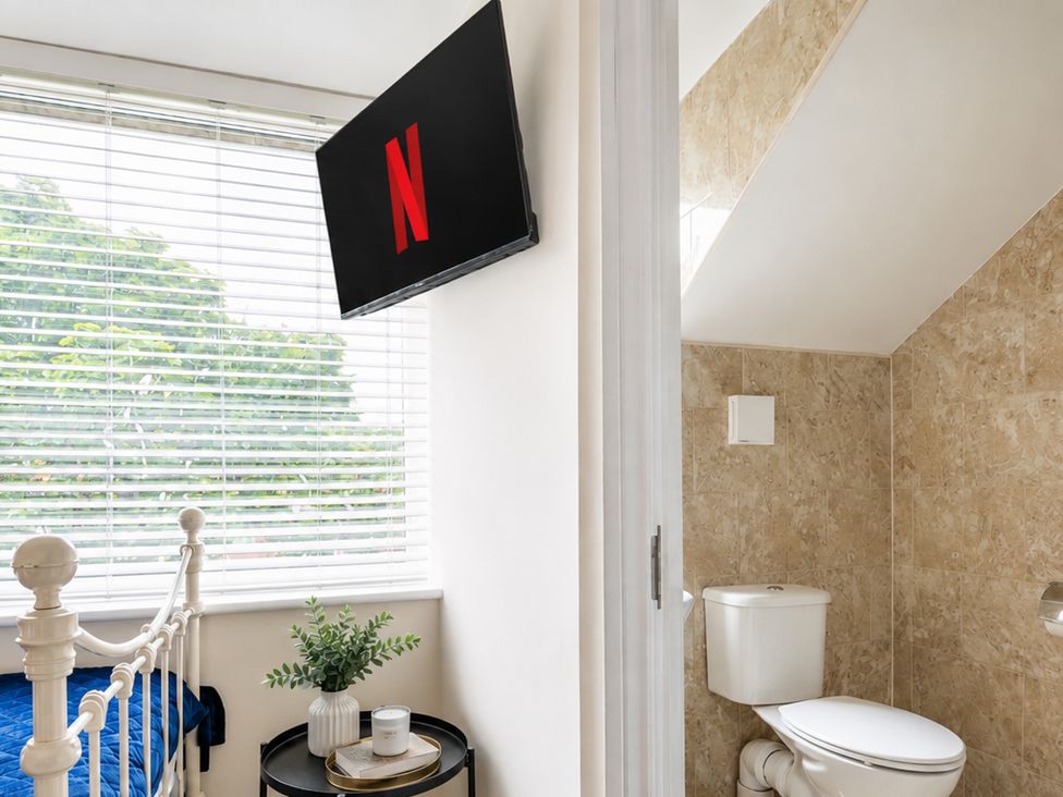 A bedroom with a bed and television at 125 Columbus Ravine, Scarborough