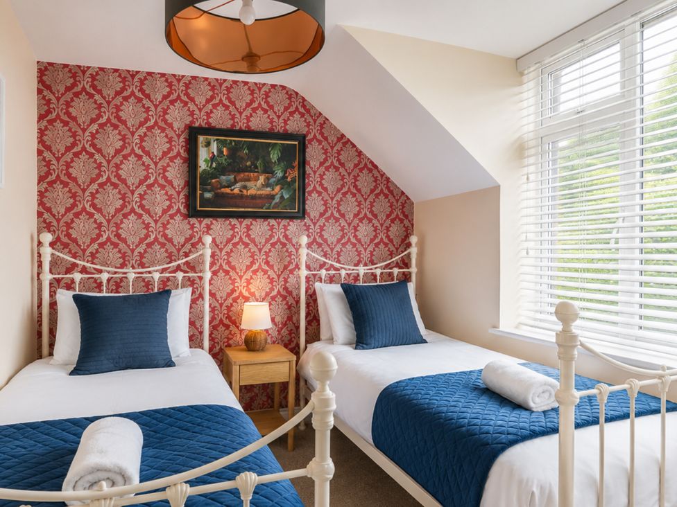 A bedroom with two beds and a painting at 125 Columbus Ravine, Scarborough