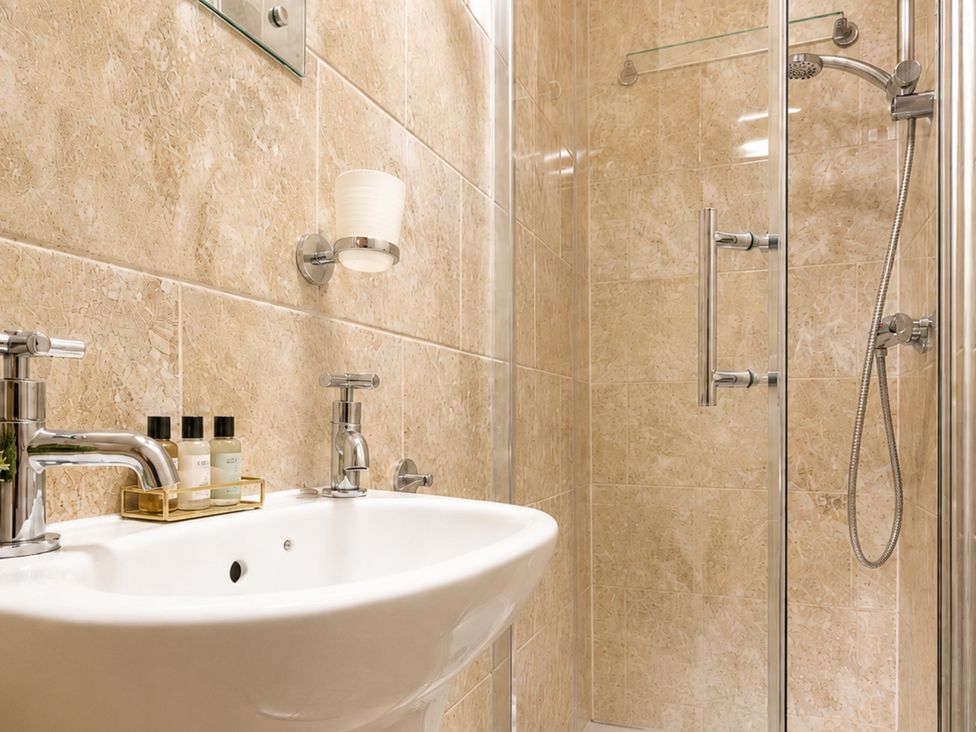 A bathroom with a sink and shower at 125 Columbus Ravine in Scarborough