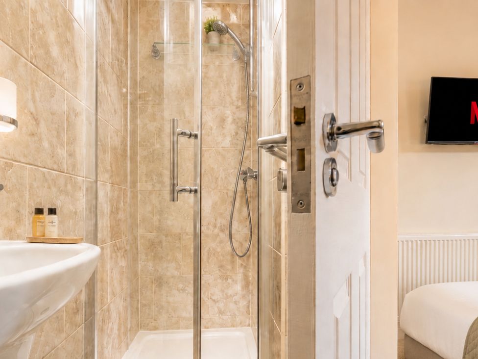 A bathroom with a shower and a sink at 125 Columbus Ravine in Scarborough