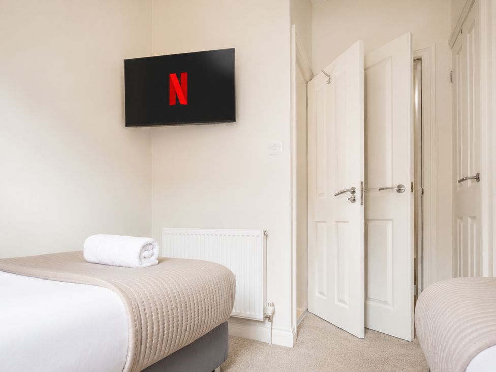 A bedroom with a bed and television at 125 Columbus Ravine Scarborough