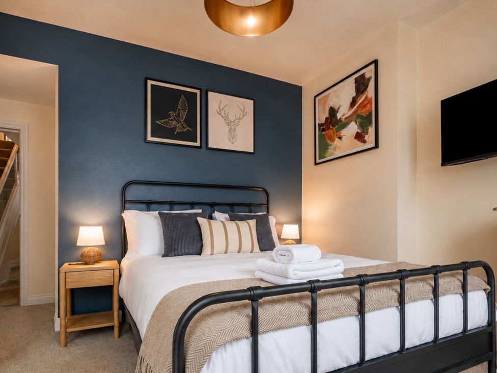 A bedroom with a bed and nightstand at 125 Columbus Ravine in Scarborough