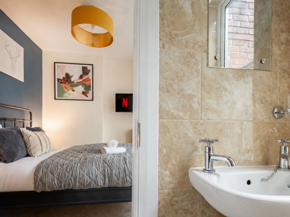 A bedroom with a bed and a television at 125 Columbus Ravine in Scarborough