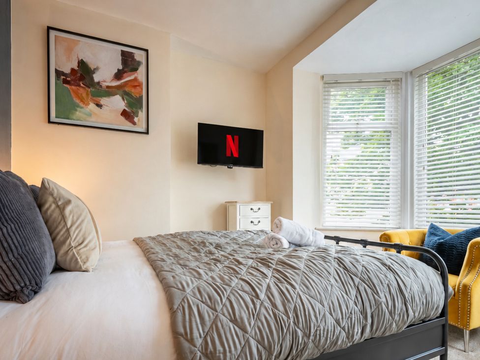 A bedroom with a bed and TV at 125 Columbus Ravine in Scarborough