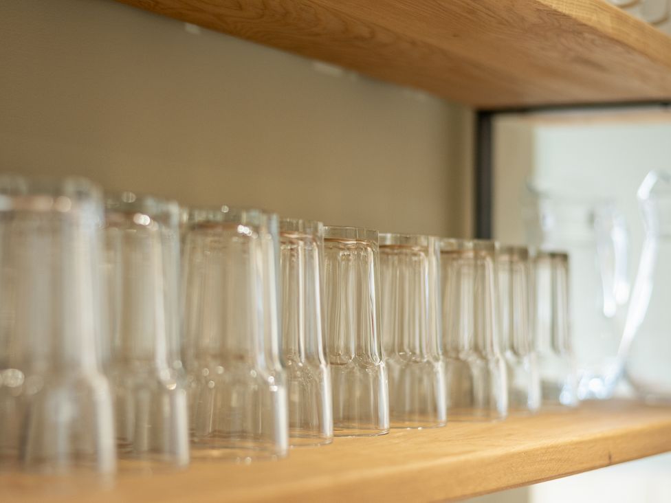 A row of glasses on a shelf at 125 Columbus Ravine in Scarborough