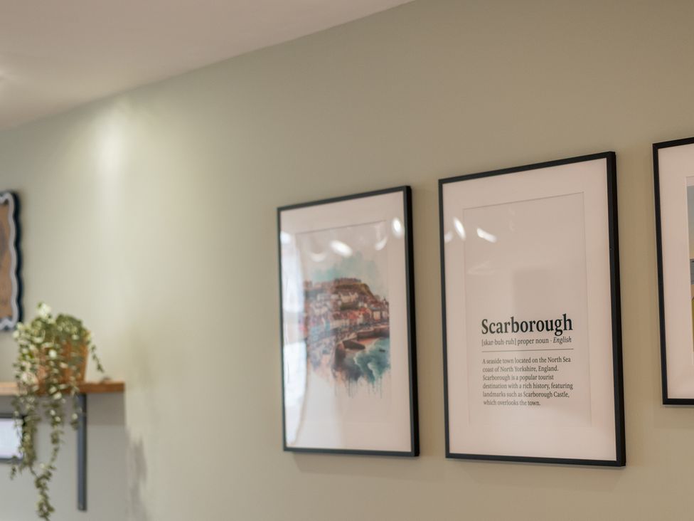 A living room with framed pictures and a shelf at 125 Columbus Ravine, Scarborough