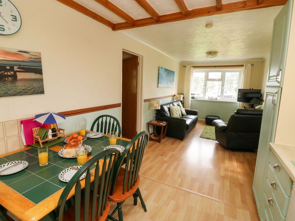 A dining room with a table set for breakfast at Cottage 28 in Brixham