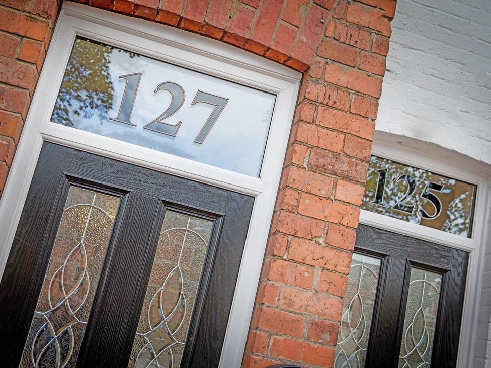 Front doors with numbers 127 and 125 at 127 Columbus Ravine Scarborough
